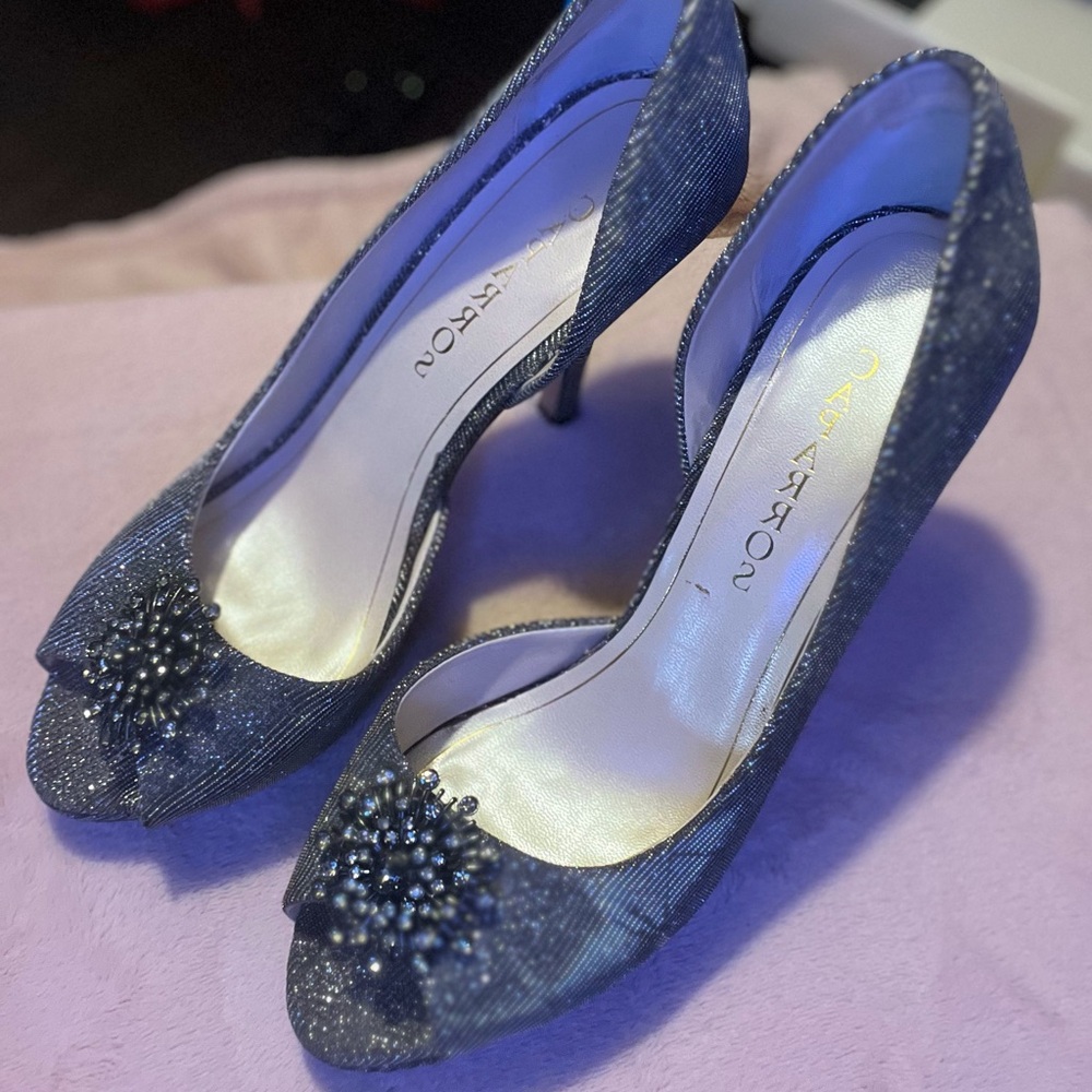 Caparros sparkly silver pumps size 8.5.  With studded rhinestone broach.